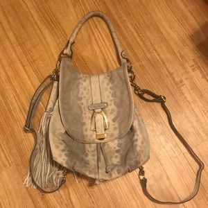Snakeskin patterned leather backpack purse. Cute